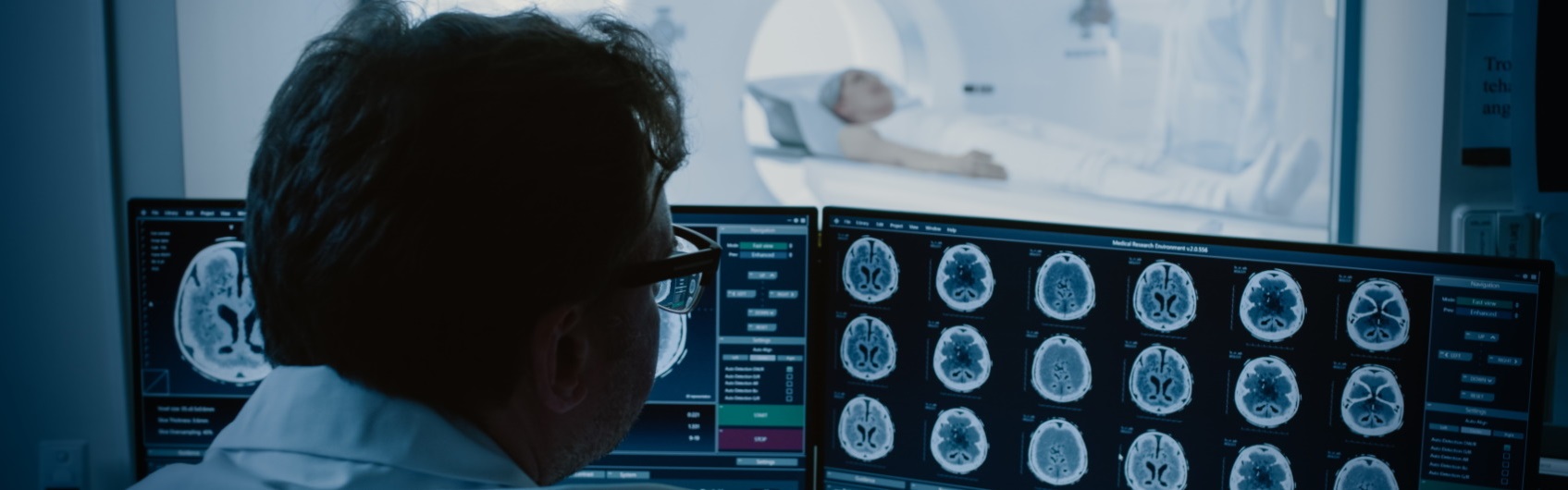 Man looking at brain scans