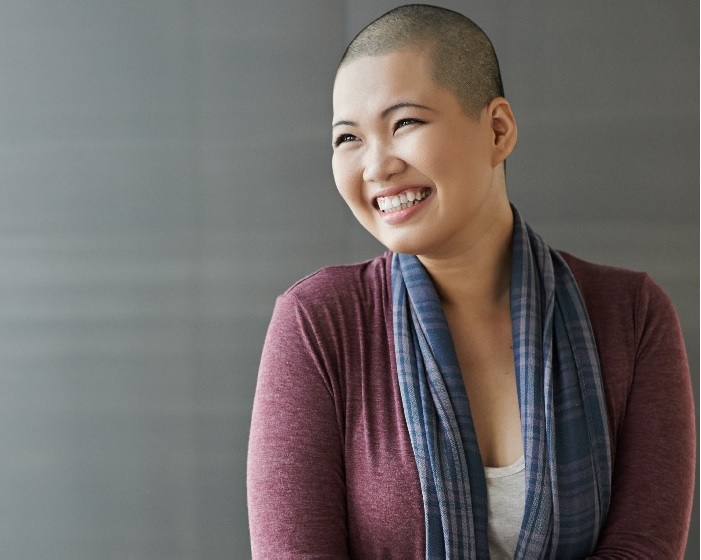 Smiling cancer survivor.